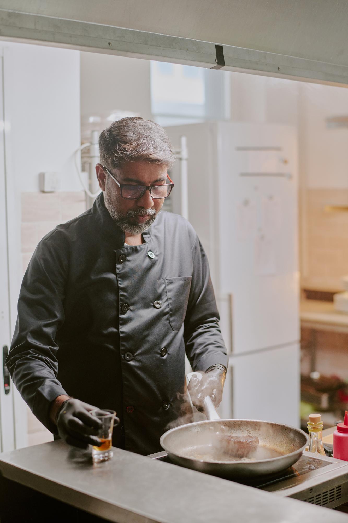 Founding chef in workshop kitchen, natural light